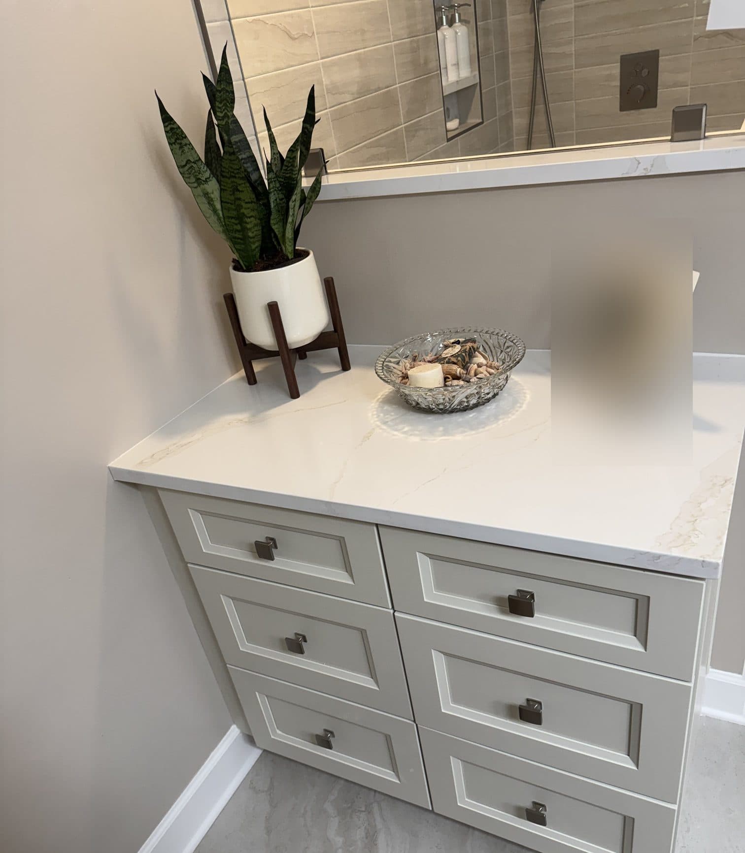 Matching drawer bank with quartz top in a Matthews, NC primary bathroom remodel