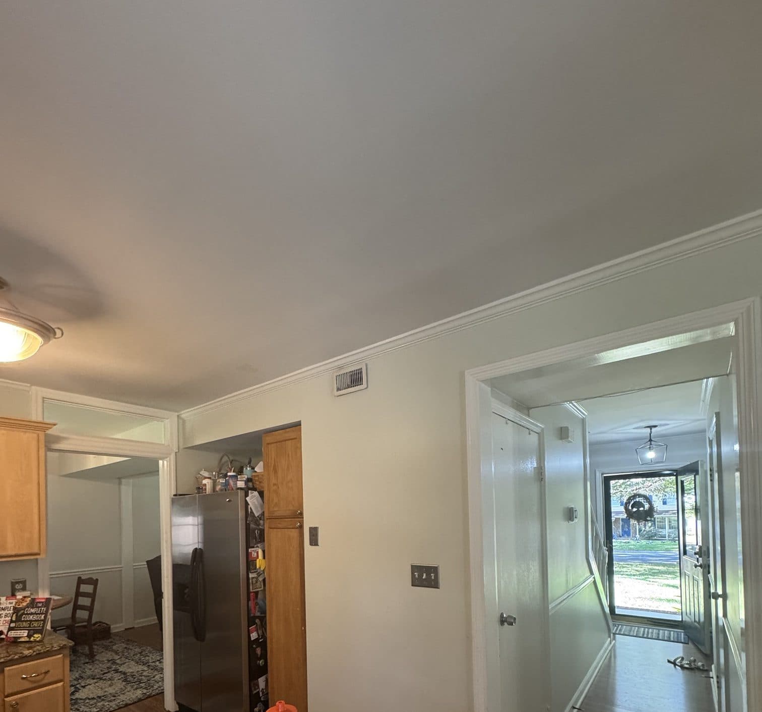 Before: original refrigerator and pantry corner in a Stonehaven, Charlotte kitchen
