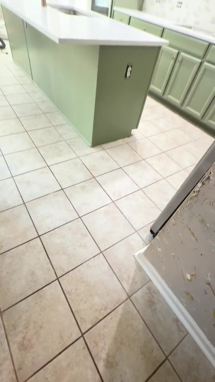 Sage and white kitchen with new cabinets and quartz counters in Matthews, North Carolina