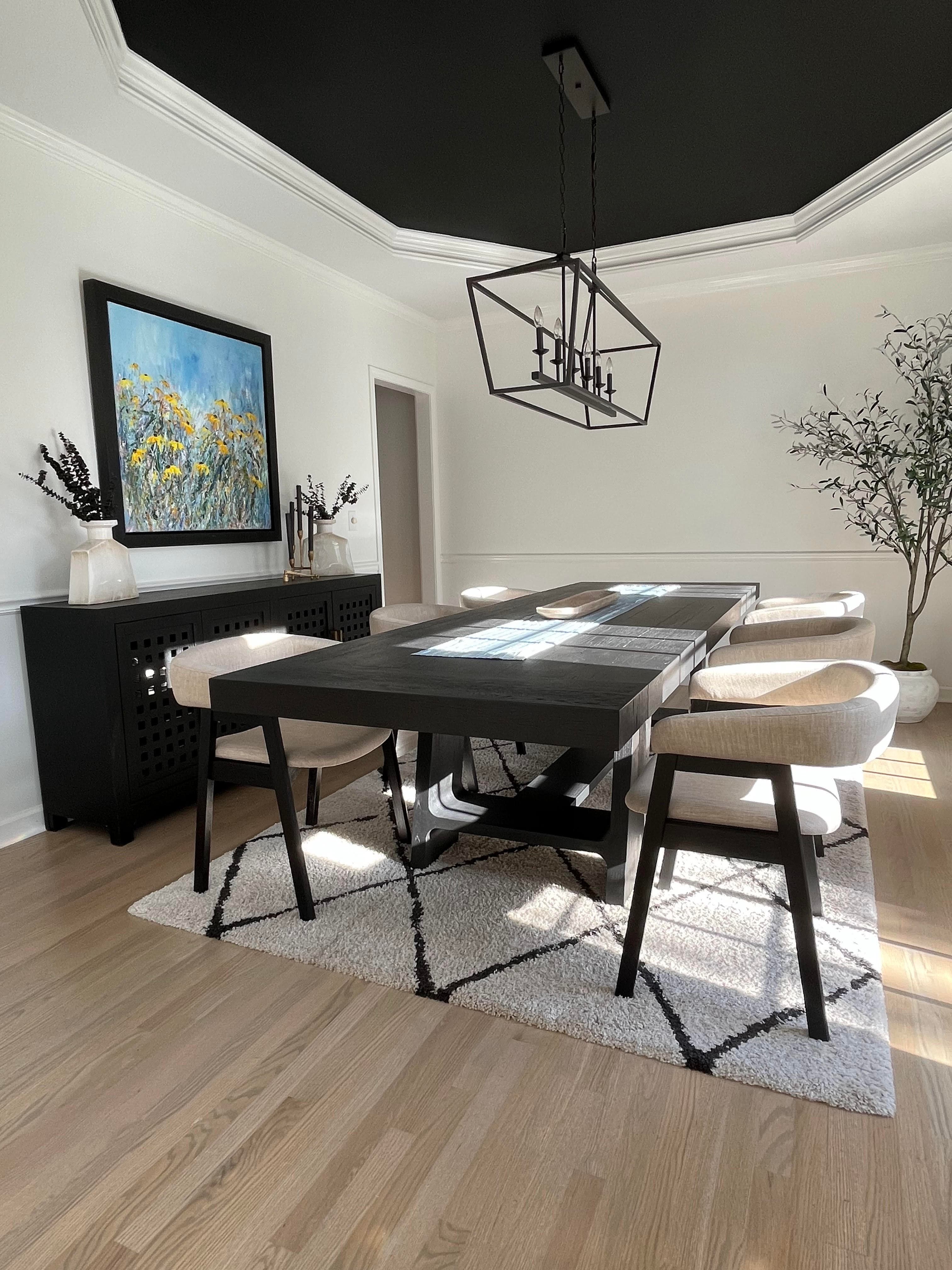 Charlotte home with light hardwood flooring in open-plan living and dining area